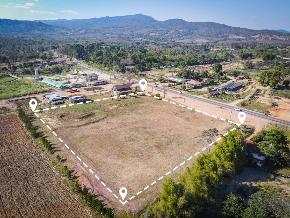 Land plot for building house aerial view, land field with pins,